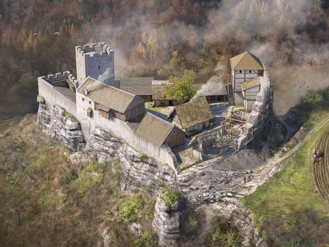 Die neue Visualisierung zeigt die Ödenburg in ihrer letzten Ausbauphase um 1180 nach Christus. Anders als bei jüngeren, «klassischen» Adelsburgen fehlt bei dieser frühen Anlage noch ein Wohnturm. Eine steinerne Wehrmauer mit Torturm und repräsentativem Gebäude umfassen einen Innenhof, in dem mehrheitlich leichte Holz- und Fachwerkbauten standen. Foto: Archäologie Baselland und Joe Rohrer, Luzern
